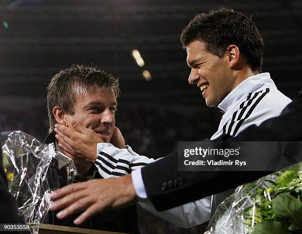 Bernd Schneider and Michael Ballack of Germany are seen ahead of the international friendly match between Germany and South Africa at BayArena on...