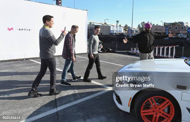 Businessman Mark Cuban , Lyft Co-founder and President John Zimmer and former NBA player Baron Davis attend the Lyft and Aptiv self-driving car...
