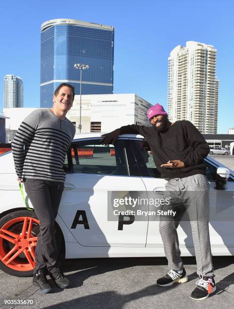 Businessman Mark Cuban and former NBA player Baron Davis attend the Lyft and Aptiv self-driving car experience during CES 2018 at the Las Vegas...