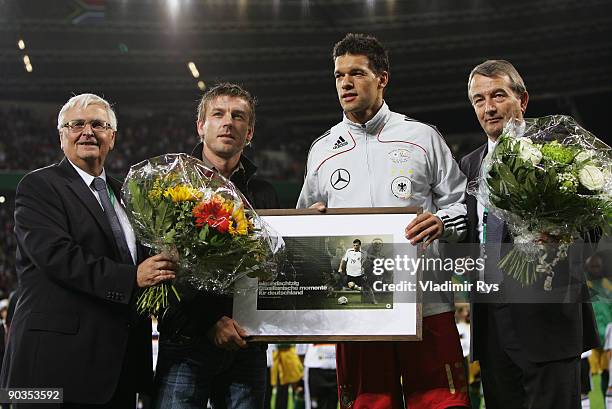 President Theo Zwanziger, Bernd Schneider, Michael Ballack and Wolfgang Niersbach pose for a photo ahead of the international friendly match between...