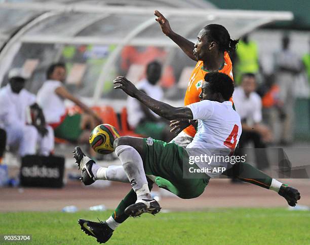 Drogba Didier of 'The Elephants', the Ivory Coast's national football team vies with Tall Mamadou of Burkina Faso on September 5, 2009 in Abidjan...