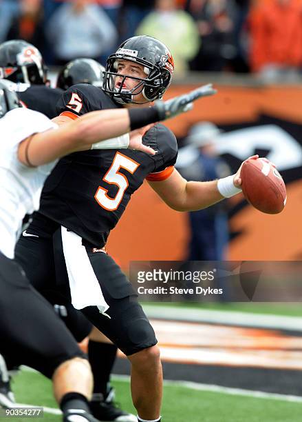 Sean Canfield of the Oregon State Beavers throws a long touchdown pass in the first quarter of the game against the Portland State Vikings at Reser...