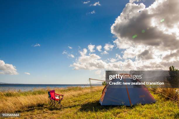 camping by lake wairarapa in summer, wairarapa, nz - summer camping new zealand stock pictures, royalty-free photos & images