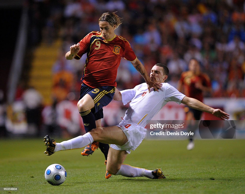 Fernando Torres Of Spain Is Tackled By Thomas Vermaelen Of Belgium fernando-torres-of-spain-is-tackled-by-thomas-vermaelen-of-belgium