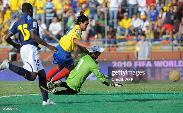 Ecuador´s Walter Ayovi looks on as Colombia´s Falcao Garcia kicks the ball past Ecuador´s goalkeeper, Jose Cevallos, during their FIFA World Cup...