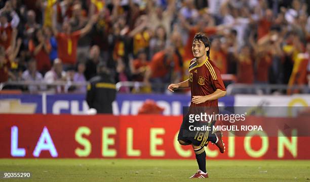 Spain's midfielder David Silva runs celebrating a goal against Belgium during their World Cup 2010 qualifier football match at the Riazor Stadium in...