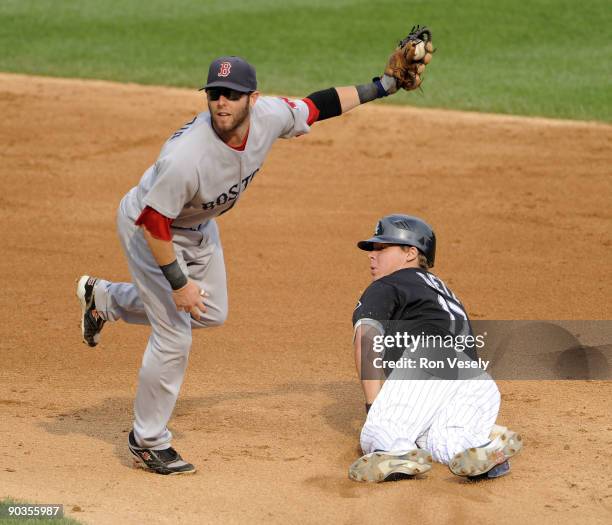 Dustin Pedroia of the Boston Red Sox applies the tag late as Chris Getz of the Chicago White Sox steals second base on September 5, 2009 at U.S....