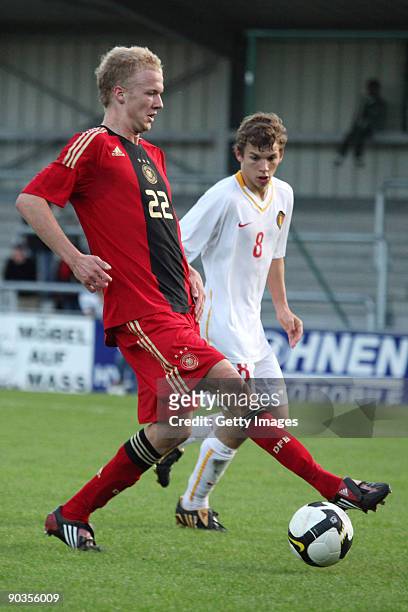 Lukas van Eenoo of Belgium challenges Kevin Voigt of Germany during the U19 international friendly match between Belgium and Germany at the...