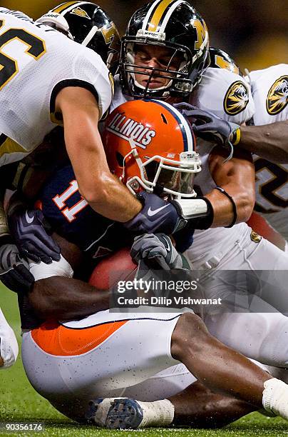 Andrew Gachkar of the University of Missouri Tigers tackles Cordale Scott of the University of Illinois Fighting Illini during the State Farm Arch...