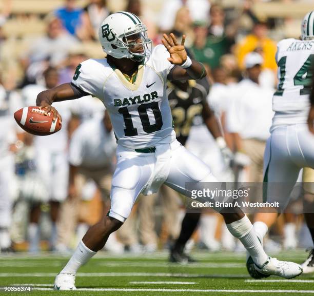 Robert Griffin III of the Baylor Bears passes the football during first half action against the Wake Forest Demon Deacons at BB&T Field on September...
