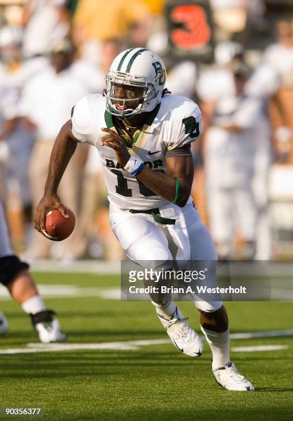Robert Griffin III of the Baylor Bears scrabbles out of the pocket against the Wake Forest Demon Deacons at BB&T Field on September 5, 2009 in...