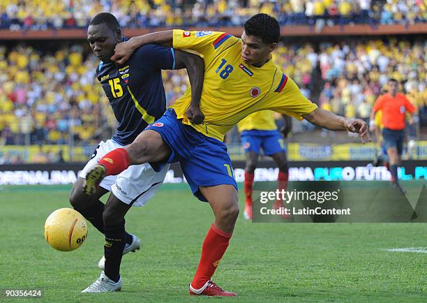 Teofilo Gutierrez of Colombia vies for the ball with Walter Ayovi of Ecuador during their FIFA World Cup South Africa-2010 South American qualifier...