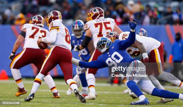 Jason Pierre-Paul of the New York Giants sacks Kirk Cousins of the Washington Redskins on December 31, 2017 at MetLife Stadium in East Rutherford,...