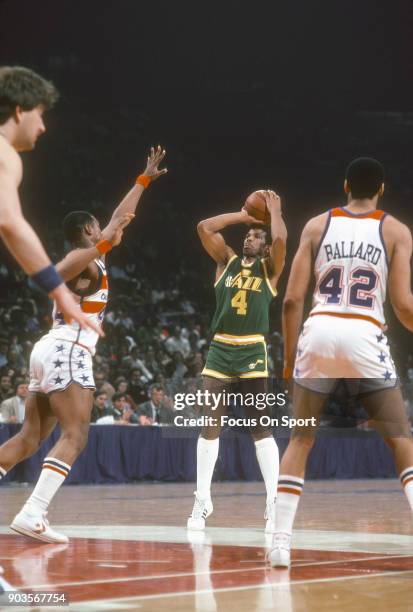 Adrian Dantley of the Utah Jazz shoots over Rick Mahorn of the Washington Bullets during an NBA basketball game circa 1981 at the Capital Centre in...