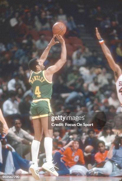Adrian Dantley of the Utah Jazz shoots against the Philadelphia 76ers during an NBA basketball game circa 1981 at The Spectrum in Philadelphia,...