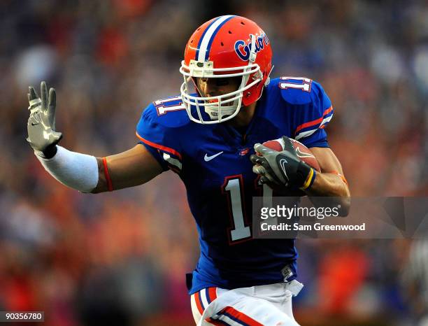 Riley Cooper of the Florida Gators runs for a touchdown during the game against the Charleston Southern Buccaneers at Ben Hill Griffin Stadium on...
