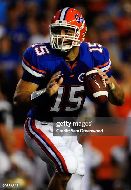 Tim Tebow of the Florida Gators attempts a pass during the game against the Charleston Southern Buccaneers at Ben Hill Griffin Stadium on September...
