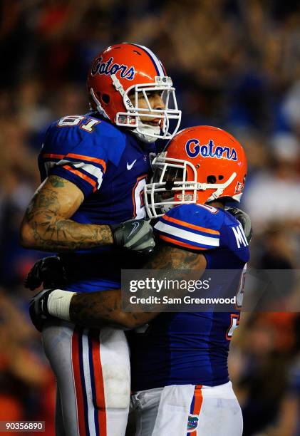 Aaron Hernandez of the Florida Gators celebrates with Lawrence Marsh following a touchdown during the game against the Charleston Southern Buccaneers...