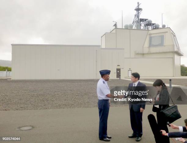 Japanese Defense Minister Itsunori Onodera visits a test complex of the land-based Aegis Ashore missile defense system on the Hawaiian island of...