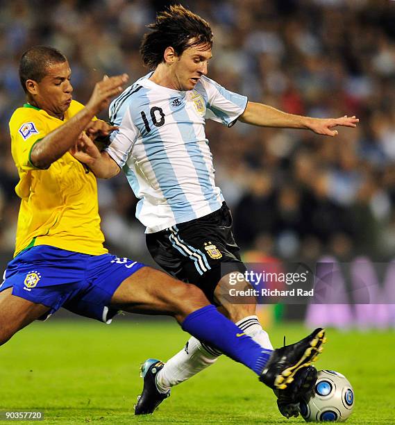 Argentina's Lionel Messi vies for the ball with Felipe Melo of Brazil during their 2010 FIFA World Cup qualifier at the Gigante de Arroyito stadium...