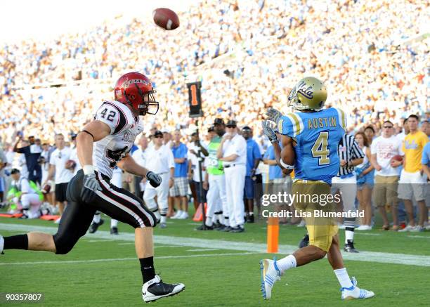 Terrence Austin of the UCLA Bruins catches a touchdown pass during the game against the San Diego State Aztecs at the Rose Bowl on September 5, 2009...