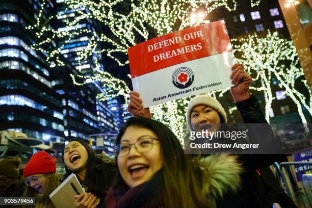 Activists rally for the passage of a "clean" Dream Act, one without additional security or enforcement measures, outside the New York office of Sen....