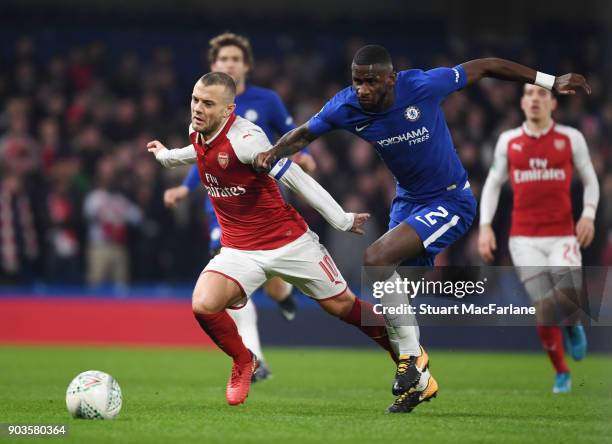 Jack Wilshere of Arsenal challenged by Antonio Rudiger of Chelsea during the Carabao Cup Semi-Final First Leg match between Chelsea and Arsenal at...