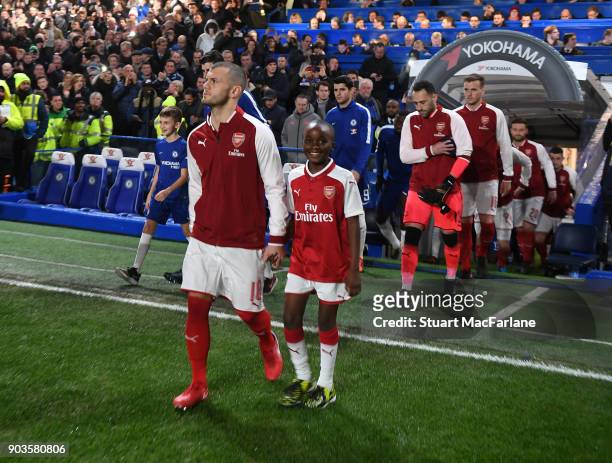 Arsenal captain Jack Wilshere leads out his team before the Carabao Cup Semi-Final First Leg match between Chelsea and Arsenal at Stamford Bridge on...
