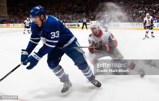 Frederik Gauthier of the Toronto Maple Leafs skates against Colin White of the Ottawa Senators during the first period at the Air Canada Centre on...