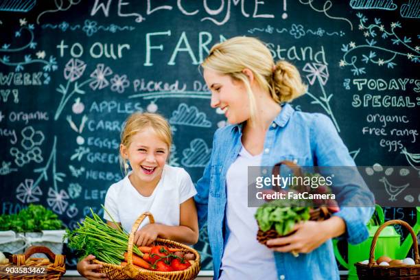 buying from the market - fete stock pictures, royalty-free photos & images