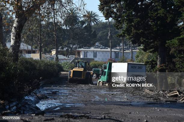 Bulldozer clears mud from the northbound 101 freeway near Montecito after a massive mudslide in Montecito, California, January 10, 2018. Rescuers...