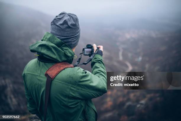 capturing a beautiful view - photographer man stock pictures, royalty-free photos & images