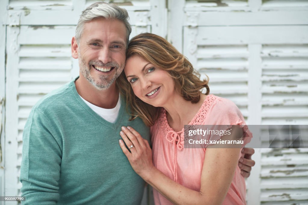 Portrait of mature couple smiling outdoors