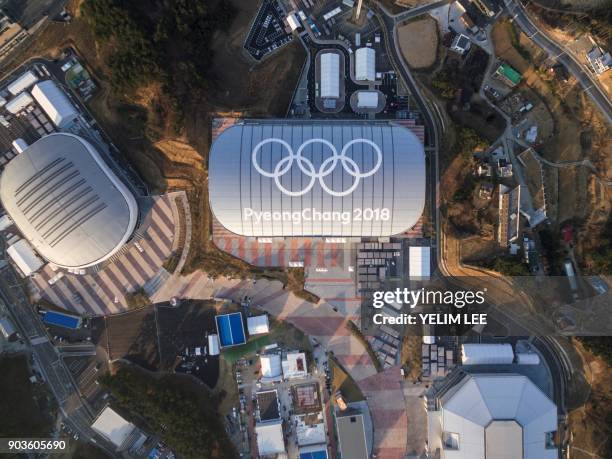 This picture taken on December 28, 2017 in Gangneung shows venues for the 2018 Pyeongchang Winter Olympics including Gangneung Ice Arena , Gangneung...