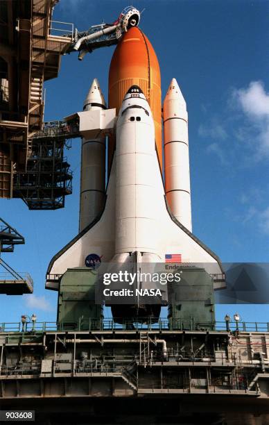 With the Rotating Service Structure on Launch Pad 39A rolled back, the Space Shuttle Endeavour on top of the Mobile Launcher Platform is poised for...