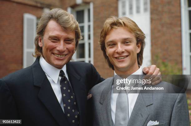 Johnny Hallyday whi his son David Hallyday on his wedding day with Estelle Lefebure in St.-Martin de Boscherville at St. Georges Church 15th...