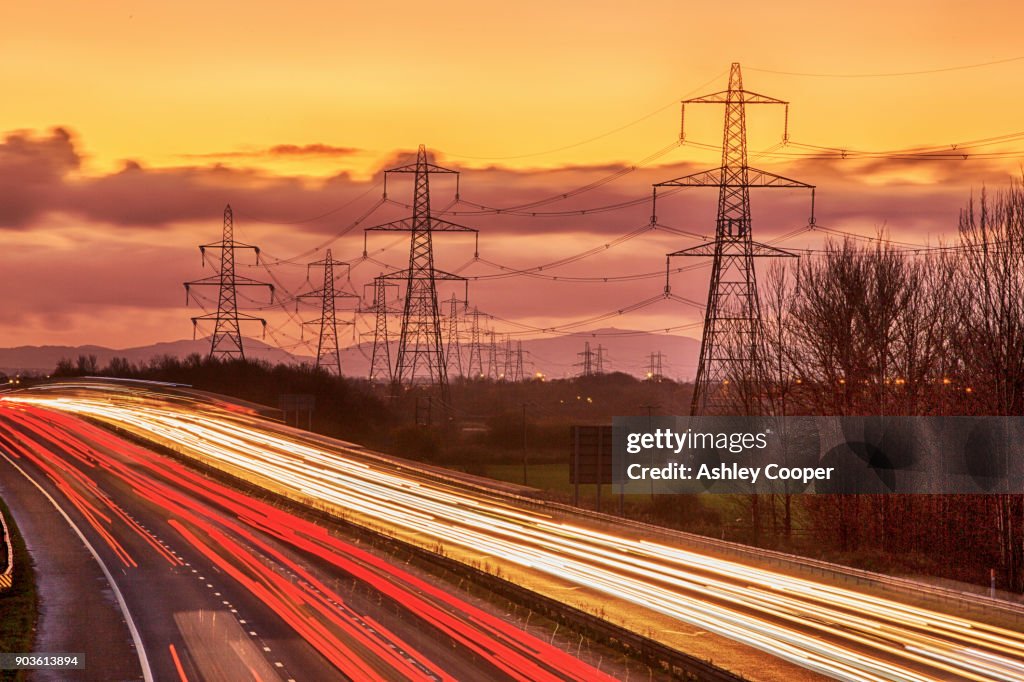 Rushhour on the M56 motorway near Helsby, Cheshire, UK at dusk.