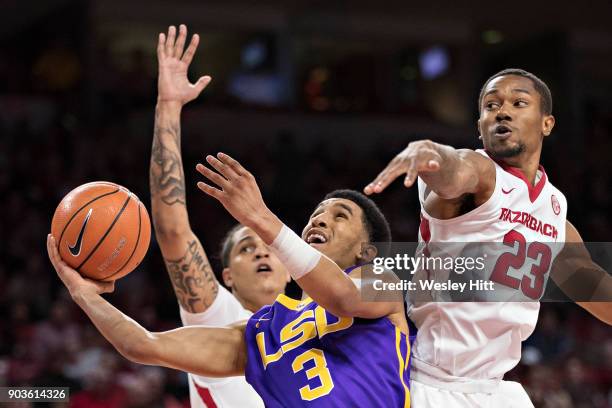 Tremont Waters of the LSU Tigers drives to the basket against C.J. Jones of the Arkansas Razorbacks at Bud Walton Arena on January 10, 2018 in...