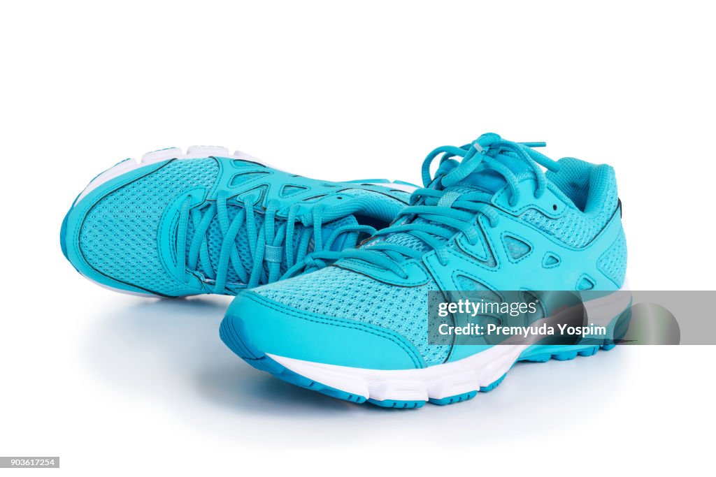 Blue sneakers on white background.