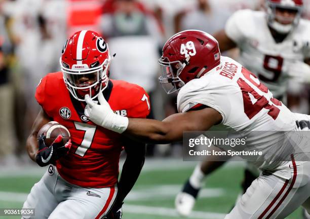 Alabama Crimson Tide defensive linemen Isaiah Buggs grabs the facemask of Georgia Bulldogs running back DAndre Swift during the College Football...