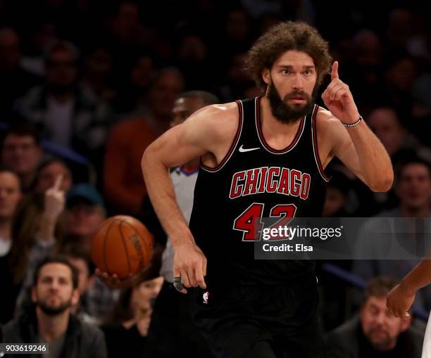 Robin Lopez of the Chicago Bulls celebrates his dunk in the second overtime period against the New York Knicks at Madison Square Garden on January...