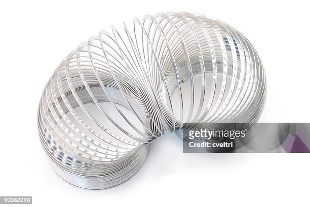 slinky - metal coil stock pictures, royalty-free photos & images