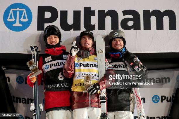 Sho Endo of Japan in second place, Mikael Kingsbury of Canada in first place and Bradley Wilson of the United States in third place celebrate on the...