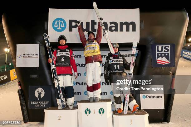 Sho Endo of Japan in second place, Mikael Kingsbury of Canada in first place and Bradley Wilson of the United States in third place celebrate on the...
