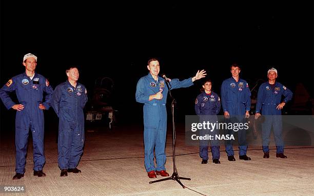 Shortly after their arrival at the Shuttle Landing Facility, the STS-88 crew talk to the media. From left, they are Mission Specialist James H....