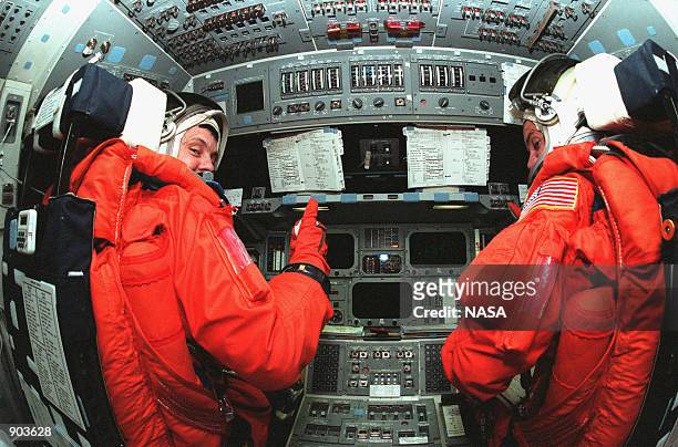 Mission Commander Robert D. Cabana and Pilot Frederick W. "Rick" Sturckow take their seats in the flight deck inside orbiter Endeavour during...