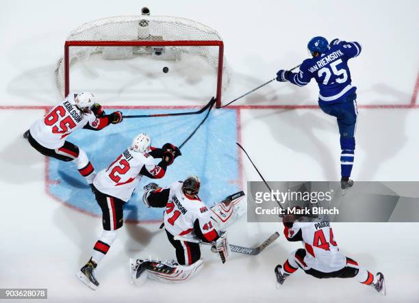 James van Riemsdyk of the Toronto Maple Leafs scores on Craig Anderson of the Ottawa Senators during the third period at the Air Canada Centre on...