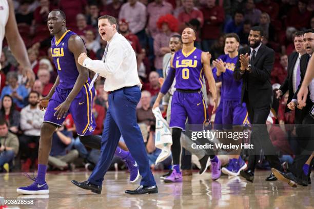 Head Coach Will Wade of the LSU Tigers celebrates with his team during a timeout against the Arkansas Razorbacks at Bud Walton Arena on January 10,...