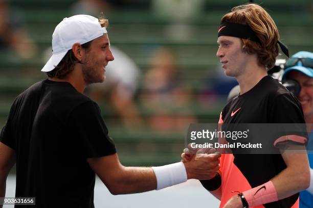Lucas Pouille of France congratulates Andrey Rublev of Russia after being defeated by him during day three of the 2018 Kooyong Classic at Kooyong on...