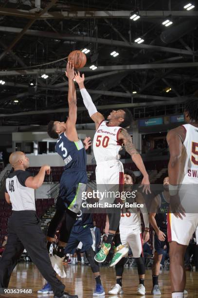 Jump ball between Anthony Brown of the Iowa Wolves and Kevin Olekaibe of the Canton Charge NBA G League Showcase Game 7 between the Iowa Wolves and...